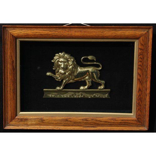 A 19th century gilt metal applique, cast as a heraldic lion ...