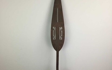 A 20TH CENTURY WEST AFRICAN CEREMONIAL CARVED WOOD PADDLE/SPEAR