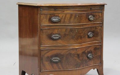A 20th century George III style mahogany serpentine fronted bachelor's chest of three long draw