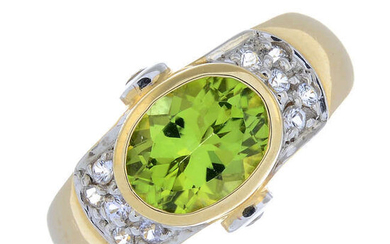 A 9ct gold peridot and cubic zirconia dress ring.