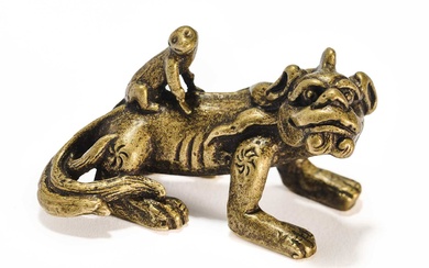 A CHINESE BRONZE 'KYLIN AND MONKEY' SCROLL WEIGHT, QING DYNASTY