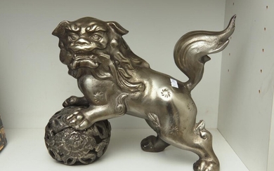 A CHINESE STEEL SHISHI DOG AND BALL, SIGNED, 27 CM WIDE