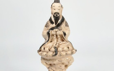 A Chinese Cizhou figure of a Daoist immortal