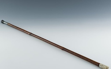 A Chinese bamboo cane with carved jade top, 19th century