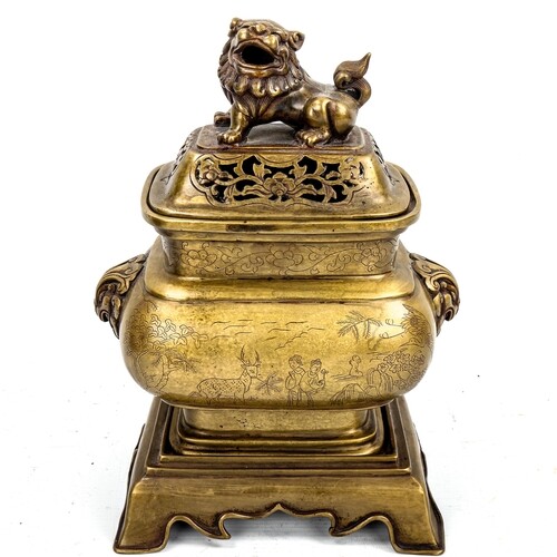 A Chinese polished bronze incense burner and cover on stand,...