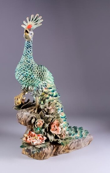 A Continental Glazed Terracotta Model of a Standing Peacock,...