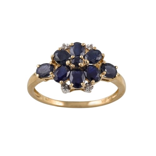 A DIAMOND AND SAPPHIRE CLUSTER RING, mounted in 9ct gold, si...