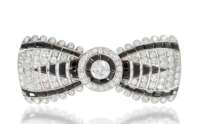 A French Cartier Art Deco diamond and onyx bow brooch