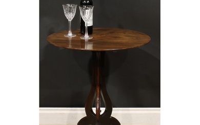 A George III mahogany tripod table, based on a design by Tho...