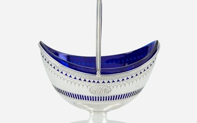 A George III silver sugar basket with cobalt glass