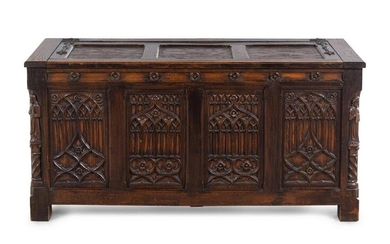 A Gothic Revival Carved Oak Chest