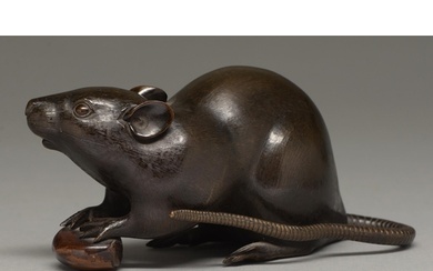 A Japanese bronze okimono of a rat, Meiji period, with finel...