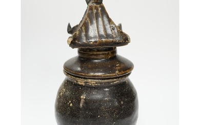 A Khmer brown glazed jar and cover, Cambodia, 12th century, ...