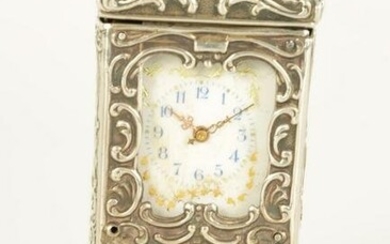 A LATE 19TH CENTURY SWISS SILVER BOUDOIR CLOCK modelled