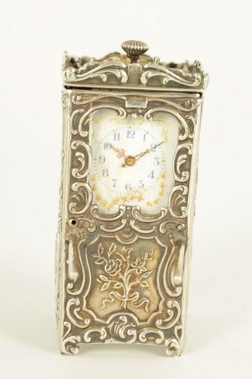 A LATE 19TH CENTURY SWISS SILVER BOUDOIR CLOCK modelled