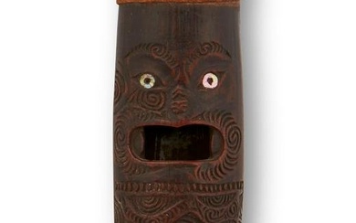 A Maori "Putorino" wooden wind instrument