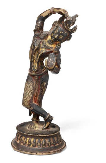 A Nepali patinated bronze figure of a dancing Tara. Nepal, 18th-19th century ?. Weight 824 g. H. 19 cm.