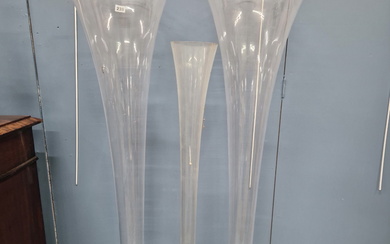 A PAIR OF CLEAR GLASS TRUMPET SHAPED VASES. H 120cms. TOGETHER WITH A SINGLE CLEAR GLASS VASE. H
