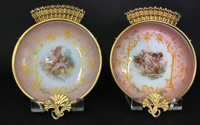 A PAIR OF ENAMELED BACCARAT OPALINE WALL PLAQUES