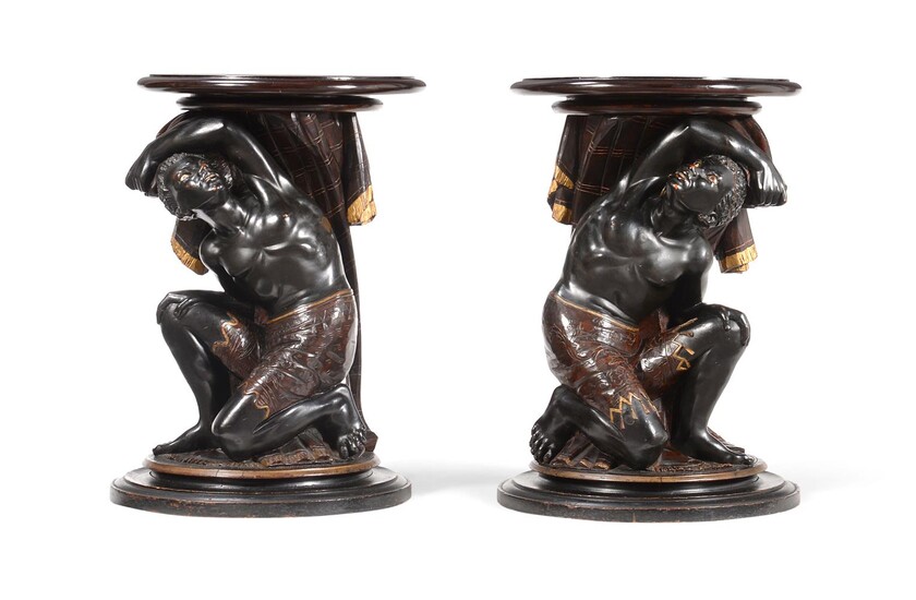 A PAIR OF ITALIAN EBONISED AND PARCEL GILT 'BLACKAMOOR' STANDS OR TABLES, POSSIBLY VENETIAN