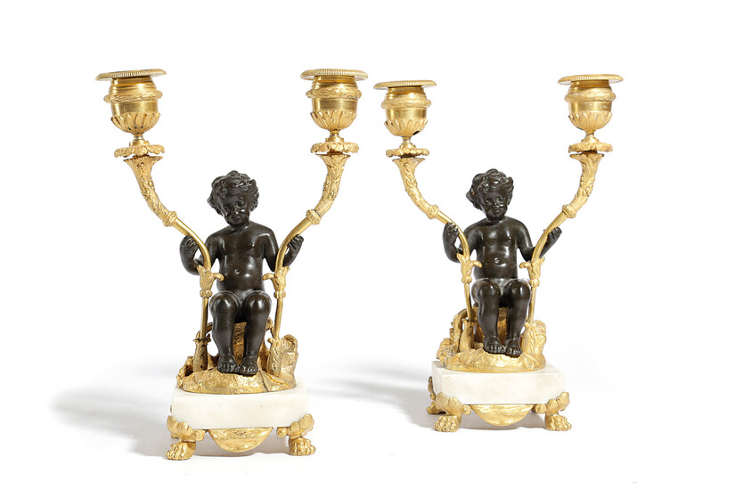 A PAIR OF LOUIS XVI GILT AND PATINATED BRONZE FIGURAL CANDELABRA