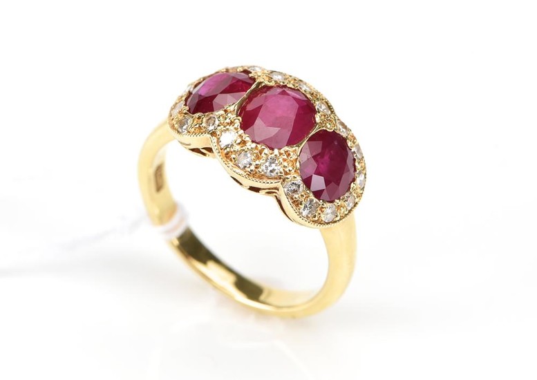 A RUBY AND DIAMOND DRESS RING IN 18CT GOLD