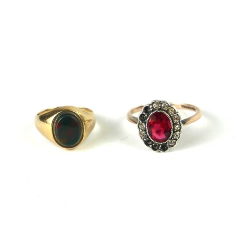 A VINTAGE 9CT GOLD AND RED TOURMALINE RING Having an oval cu...