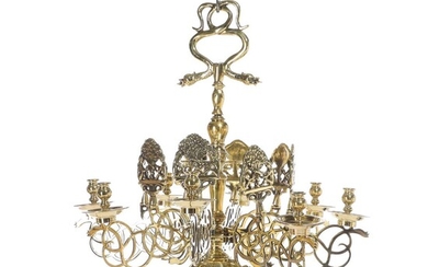 NOT SOLD. A brass chandelier with eight light arms with motifs of Adam and Eva....