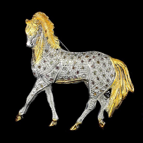 NOT SOLD. A brooch in the shape of a horse set with numerous circular-cut multi coloured saphires, mounted in rhodium and gold plated sterling silver. Approx. 4 x 4.5 cm – Bruun Rasmussen Auctioneers of Fine Art