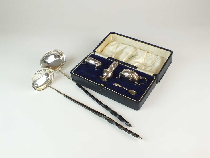 A cased set of silver cruets and two toddy ladles