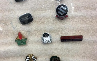 A collection of vintage motorcycle and lorry pin badges and...