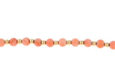 A coral bead bracelet.