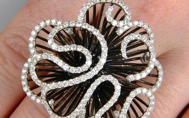A diamond abstract floral dress ring. Total diamond