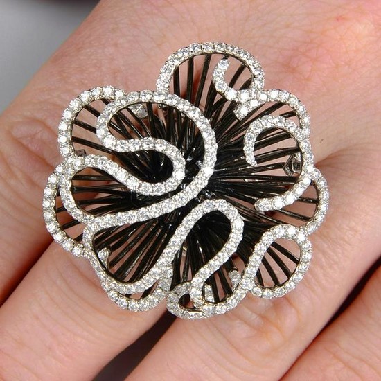 A diamond abstract floral dress ring. Total diamond
