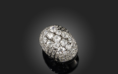 A diamond cocktail ring, France, mid 20th century, of bombé design, centring on a cluster of