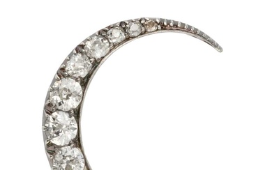 A diamond crescent brooch, set with thirteen graduated brilliant cut...