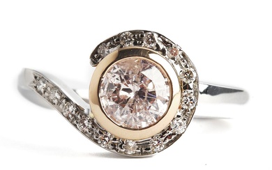A diamond ring set with a brilliant-cut enhanced pink-brown diamond weighing app....