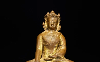 A gilt-copper alloy figure of Buddha, Tibet, 14th / 15th century