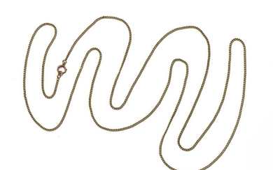A gold curb link guard chain