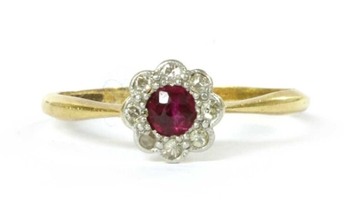 A gold ruby and diamond cluster ring