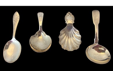A group of four silver caddy spoons Comprising of a shell s...