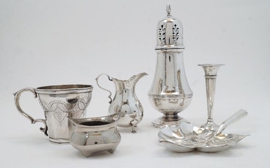 A group of silver, comprising: a sugar caster, Birmingham, 1960, Henry Clifford Davis, with flambeau finial to pierced cover, on baluster body and circular foot, 20.5cm high; a milk jug, Exeter, 1878, Josiah Williams & Co, makers mark rubbed, with...