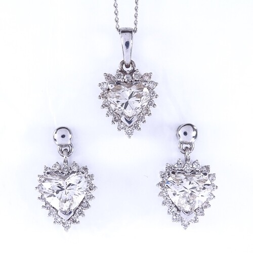 A heart shaped diamond cluster pendant necklace and stud ear...