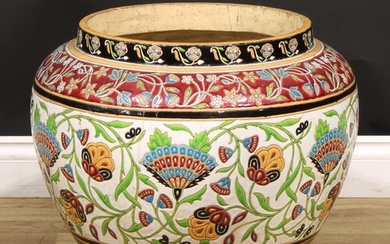 A large 19th century earthenware jardiniere, decorated in po...