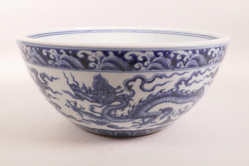 A large Chinese blue and white porcelain bowl decorated with...