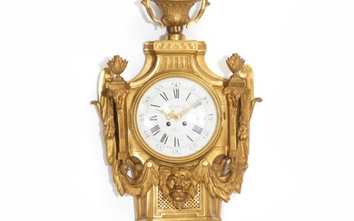 A large French Louis XVI style gild bronze wall clock, white enamel...