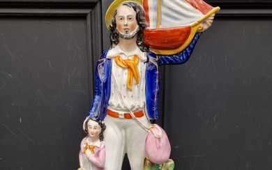 A large Victorian Staffordshire pottery figure of 'Begging S...