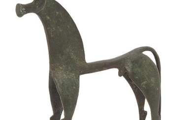 A large decorative bronze geometric Greek style horse, with trumpet-shaped mouth, forward curving ears and long tail extending to the openwork base, 17.2cm high. Provenance: Anthony Powell (1935-2021) Stylistically based on, and probably cast from...