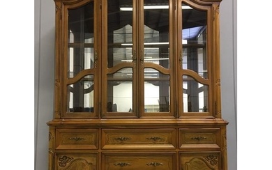 A large, walnut-veneered display cabinet. Glazed/shelved cup...