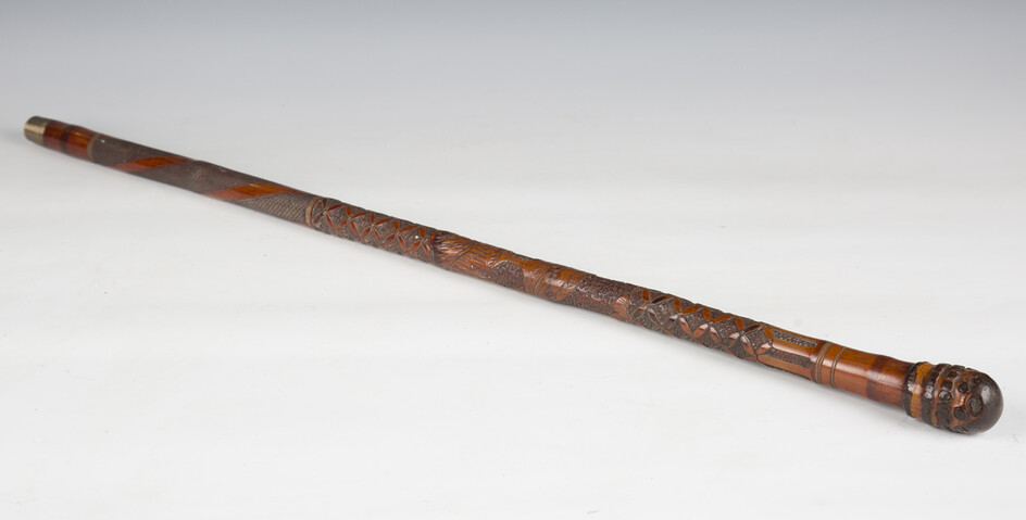 A late 19th century Japanese bamboo walking cane, carved in overall relief with birds and foliage, l